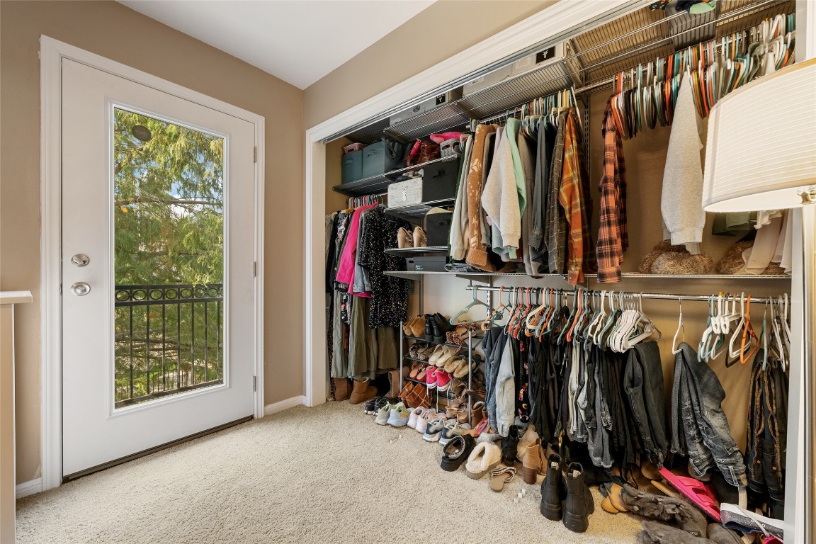 6900 East Riverside Drive, Unit 12 Austin, TX 78741 - Photo 22 of 27 a view of walk in closet with clothes