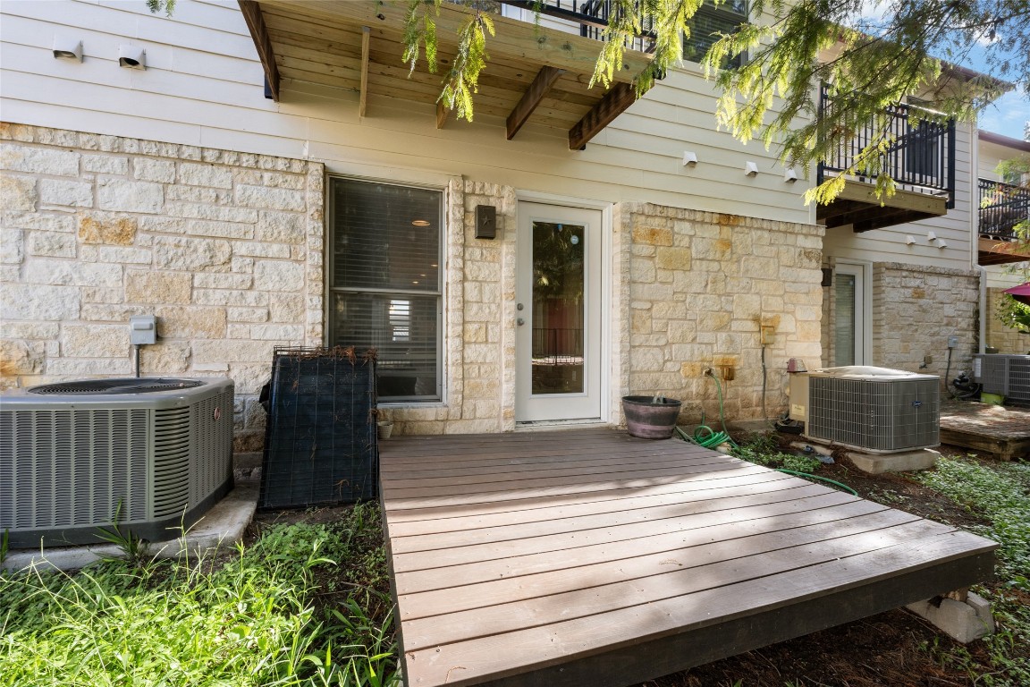 6900 East Riverside Drive, Unit 12 Austin, TX 78741 - Photo 27 of 27 a view of a patio with table and chairs and potted plants