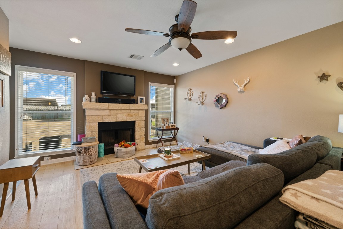 6900 East Riverside Drive, Unit 12 Austin, TX 78741 - Photo 6 of 27 a living room with furniture a fireplace and a flat screen tv