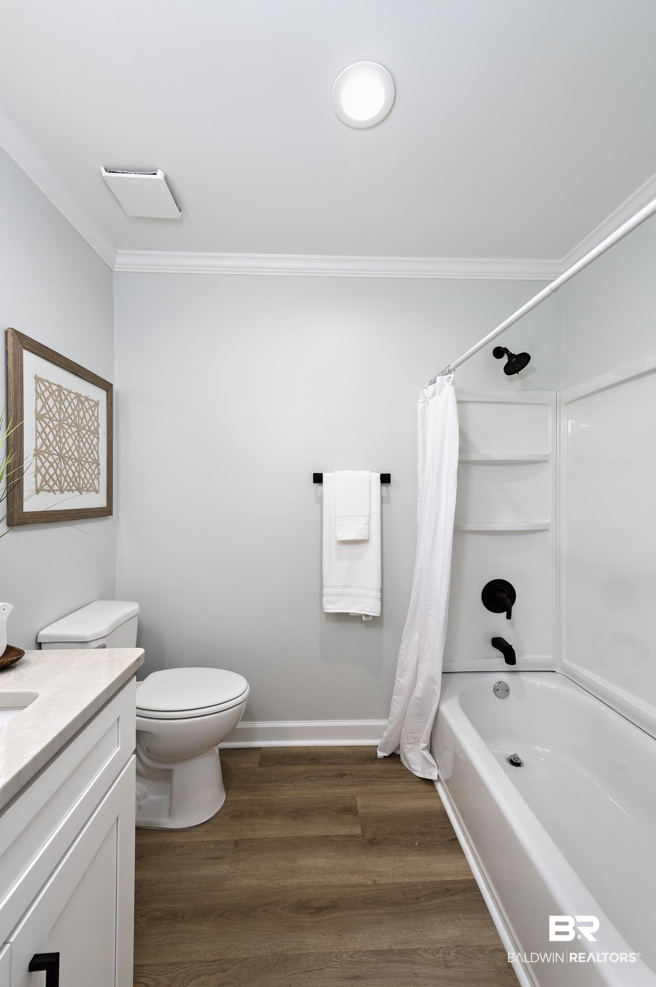 6001 Camp Halls Mill Road Mobile, AL 36619 - Photo 23 of 52 Full bathroom with ornamental molding, dark wood-type flooring, shower / tub combo with curtain, and vanity