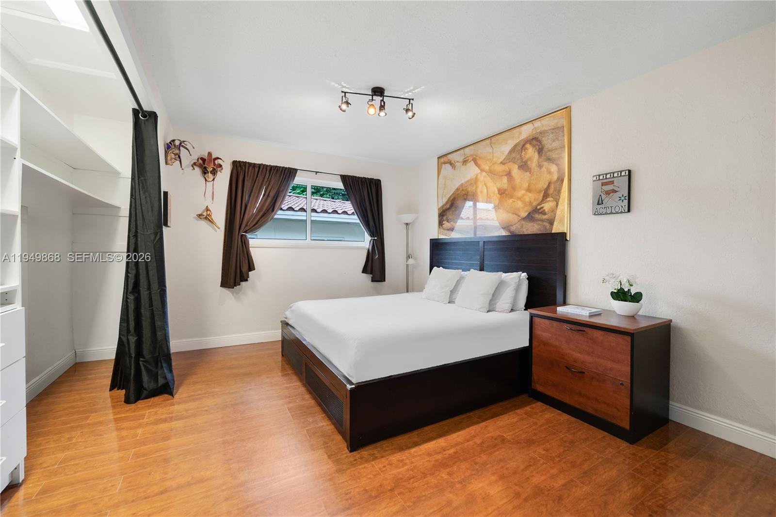 1155 South Biscayne Point Road Miami Beach, FL 33141 - Photo 14 of 23 a living room with furniture and a large window
