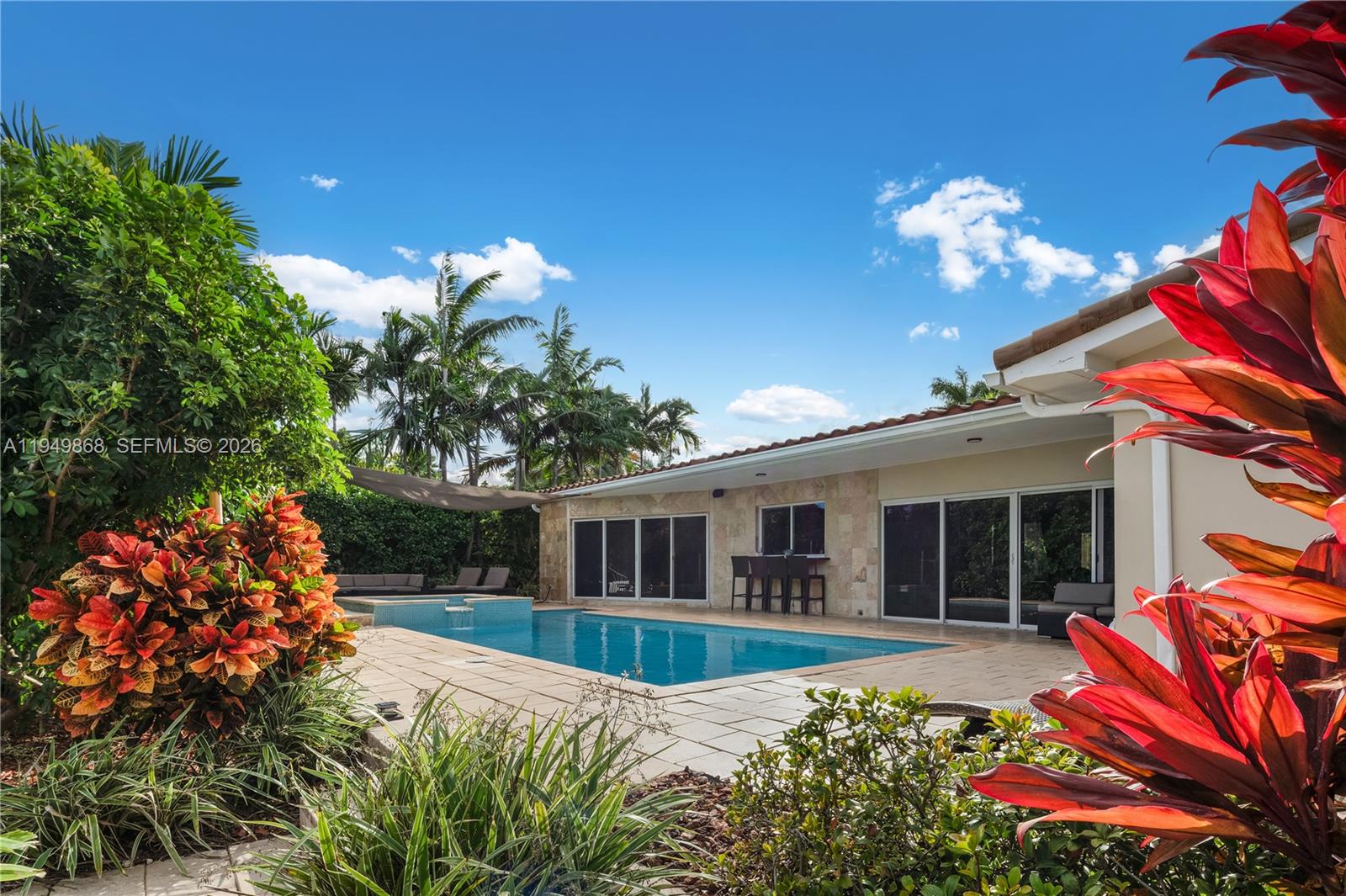 1155 South Biscayne Point Road Miami Beach, FL 33141 - Photo 4 of 23 a view of a house with a yard