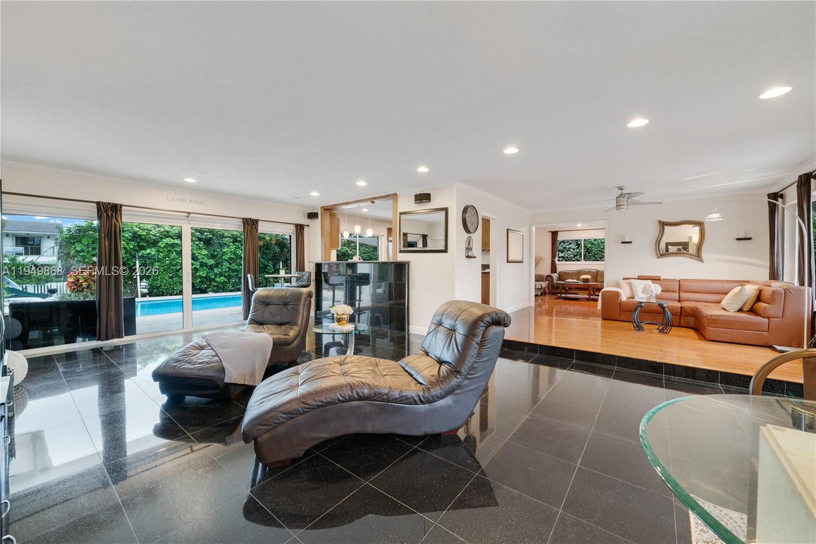1155 South Biscayne Point Road Miami Beach, FL 33141 - Photo 6 of 23 a living room with furniture and a large window