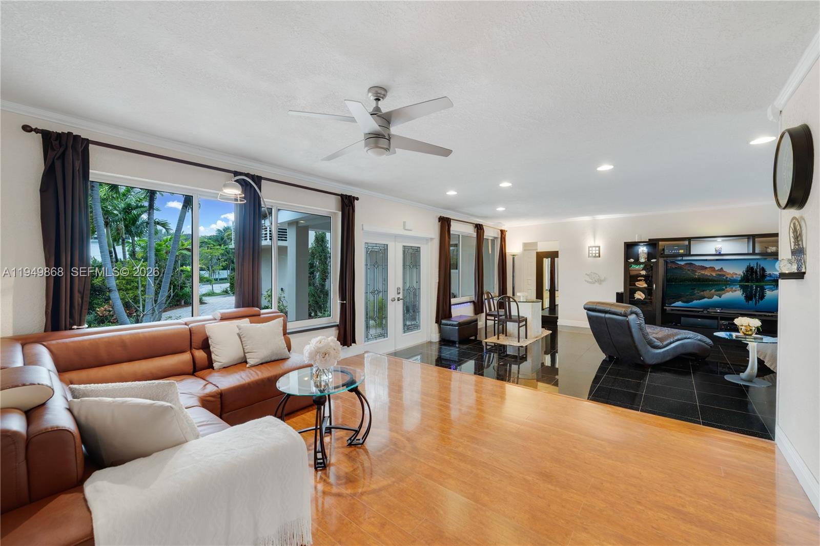 1155 South Biscayne Point Road Miami Beach, FL 33141 - Photo 7 of 23 a living room with furniture and a flat screen tv