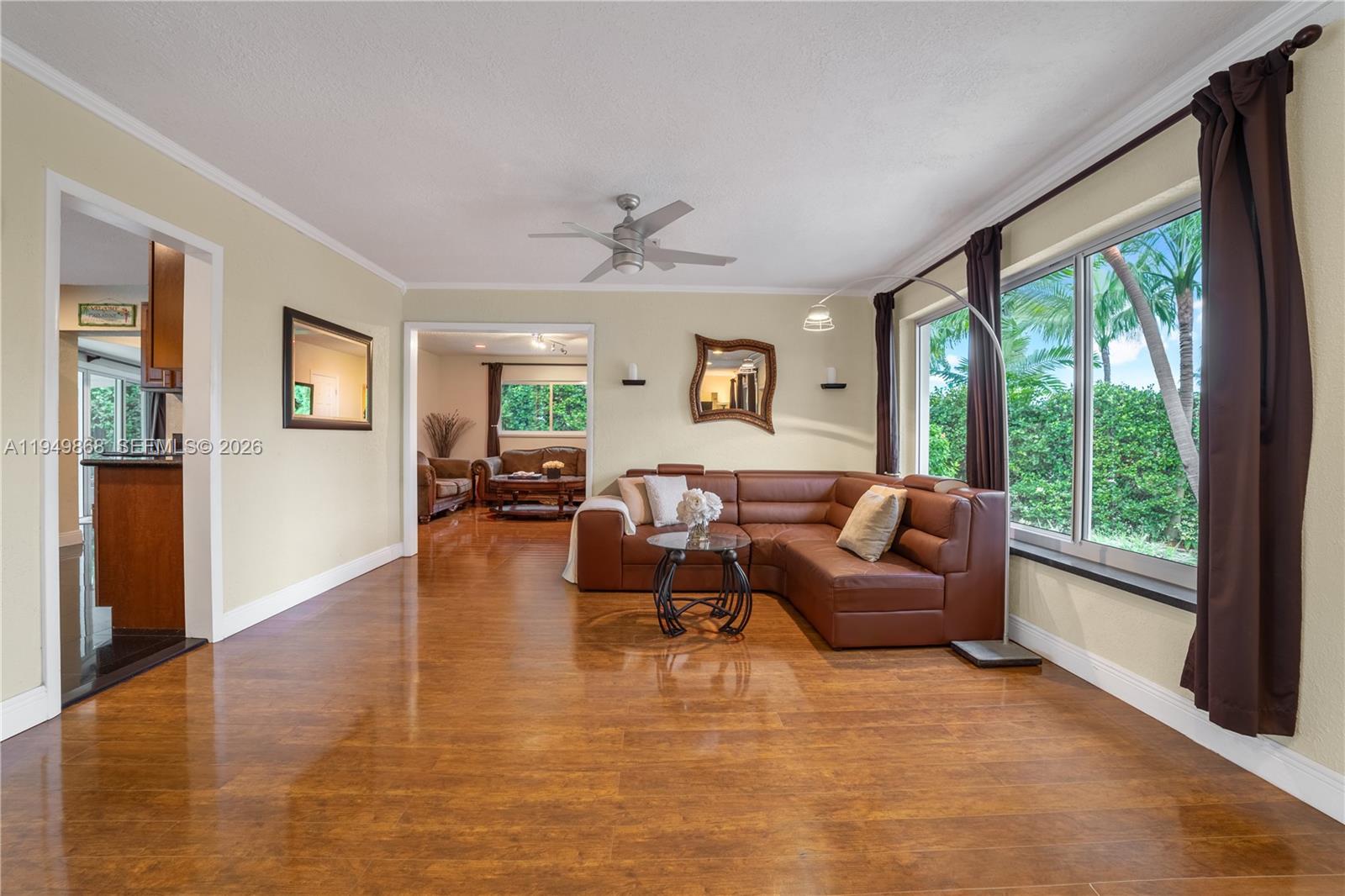 1155 South Biscayne Point Road Miami Beach, FL 33141 - Photo 8 of 23 a living room with furniture and a large window