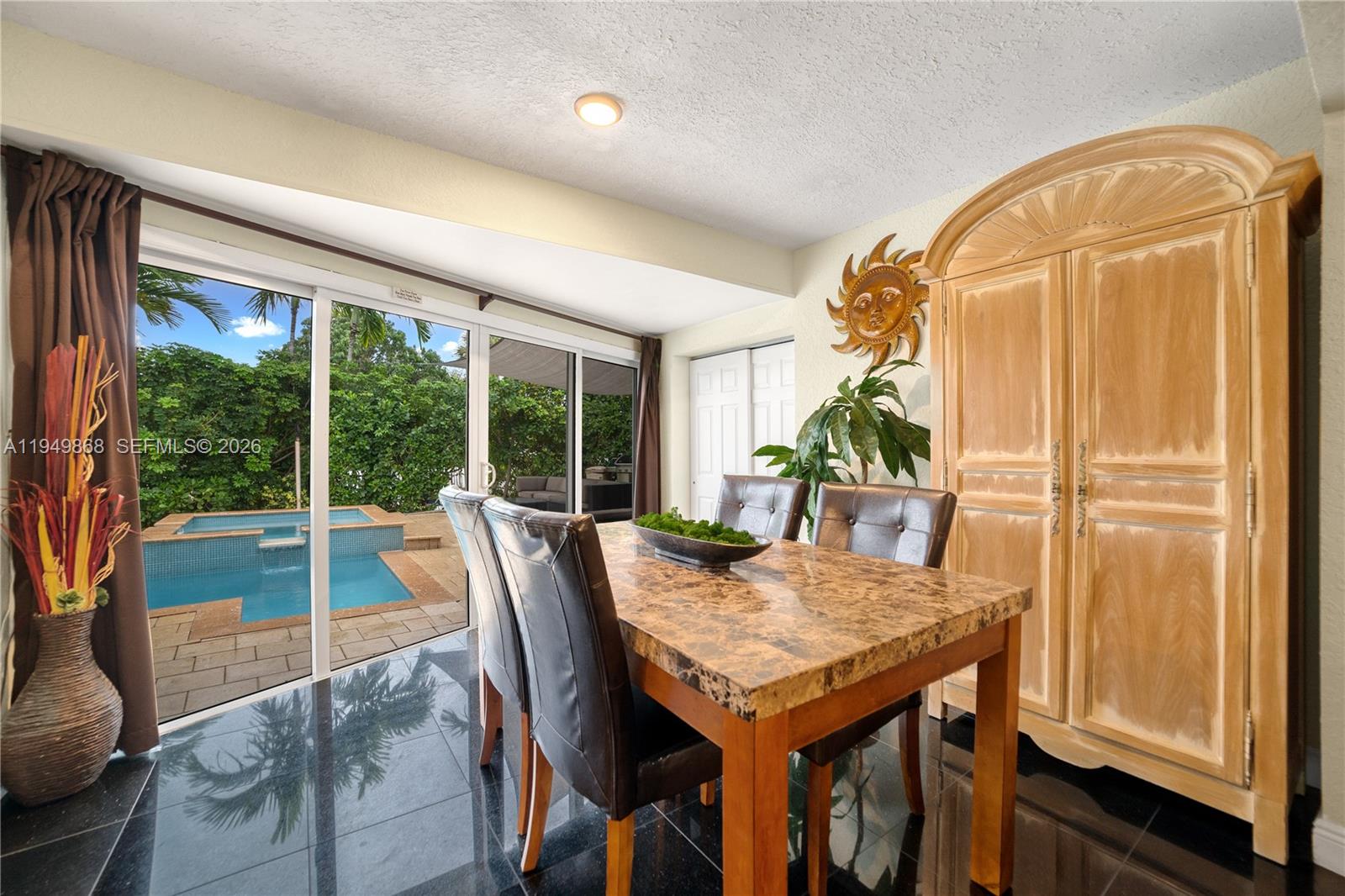1155 South Biscayne Point Road Miami Beach, FL 33141 - Photo 9 of 23 a view of a dining room with furniture window and outside view