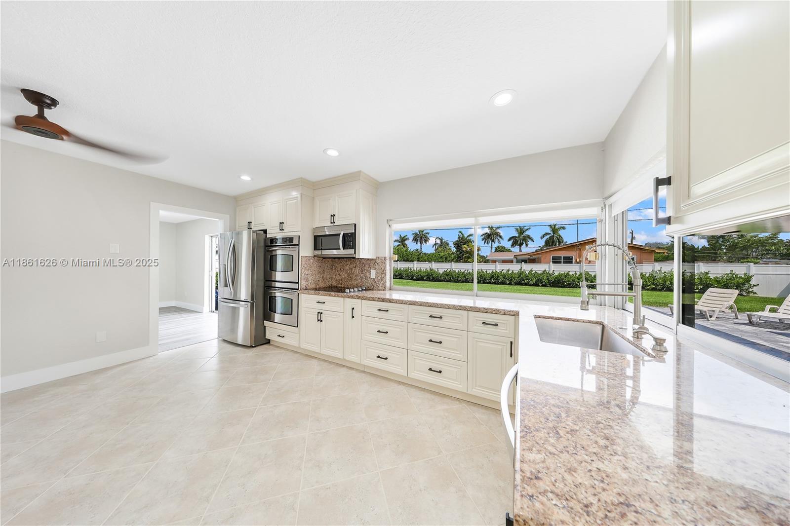 8355 Southwest 89th Street Miami, FL 33156 - Photo 14 of 29 a view of kitchen with furniture and refrigerator