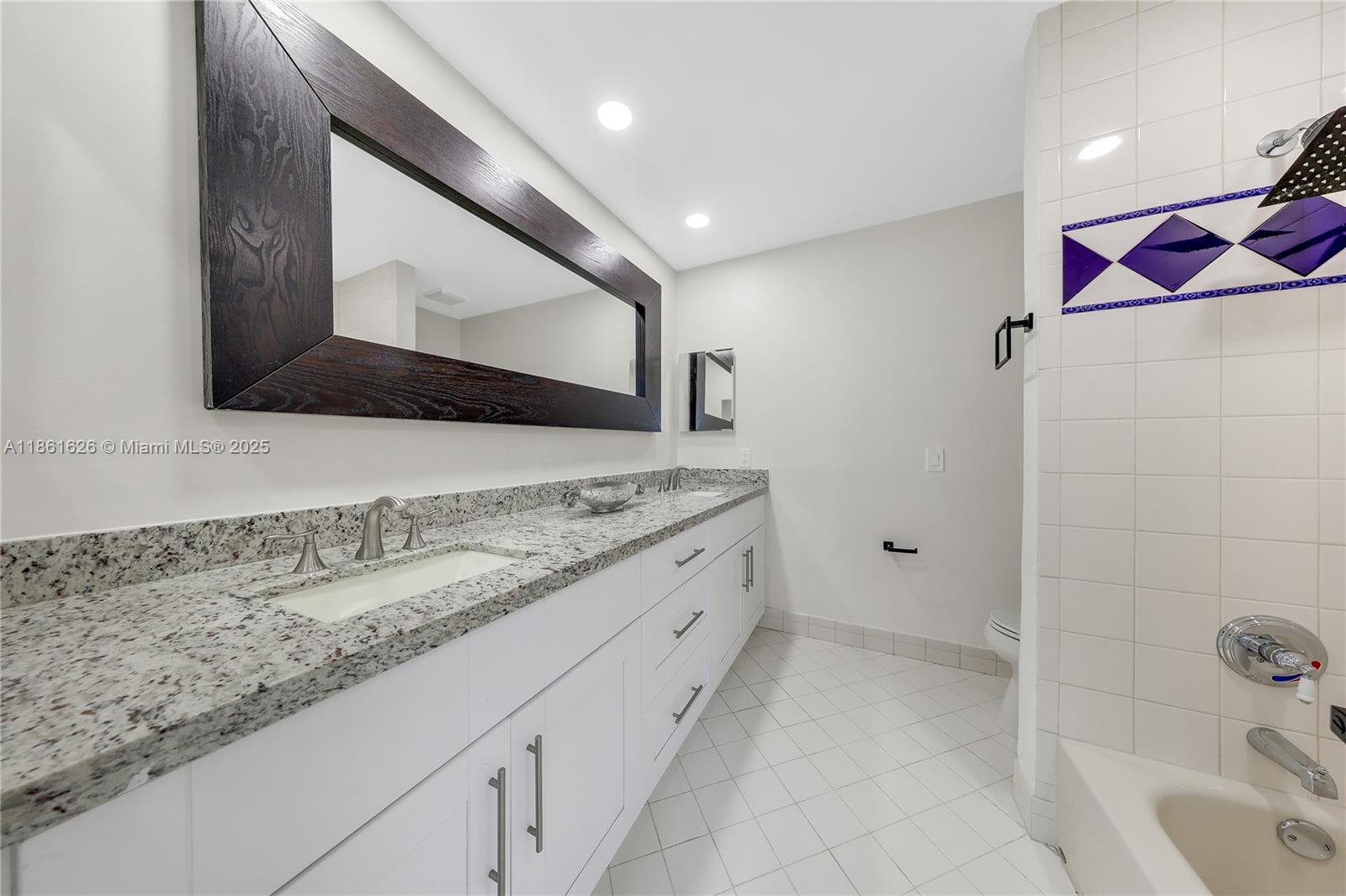 8355 Southwest 89th Street Miami, FL 33156 - Photo 15 of 29 a bathroom with a granite countertop sink a vanity and a shower