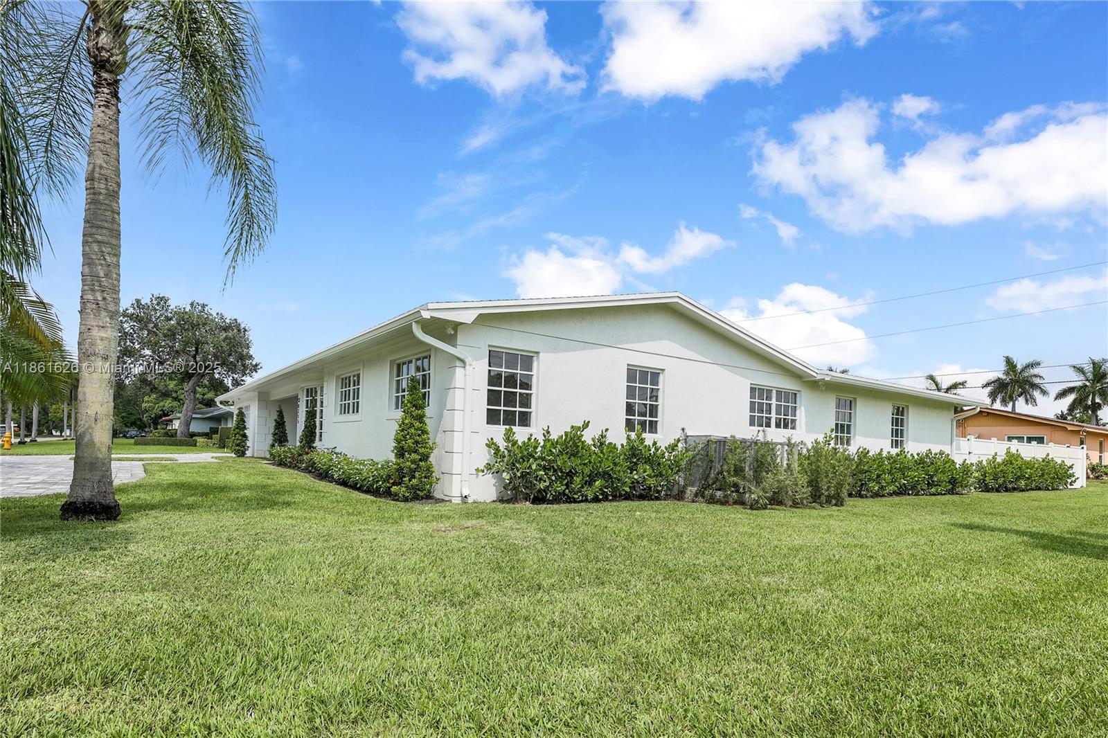 8355 Southwest 89th Street Miami, FL 33156 - Photo 2 of 29 a view of backyard of house with green space