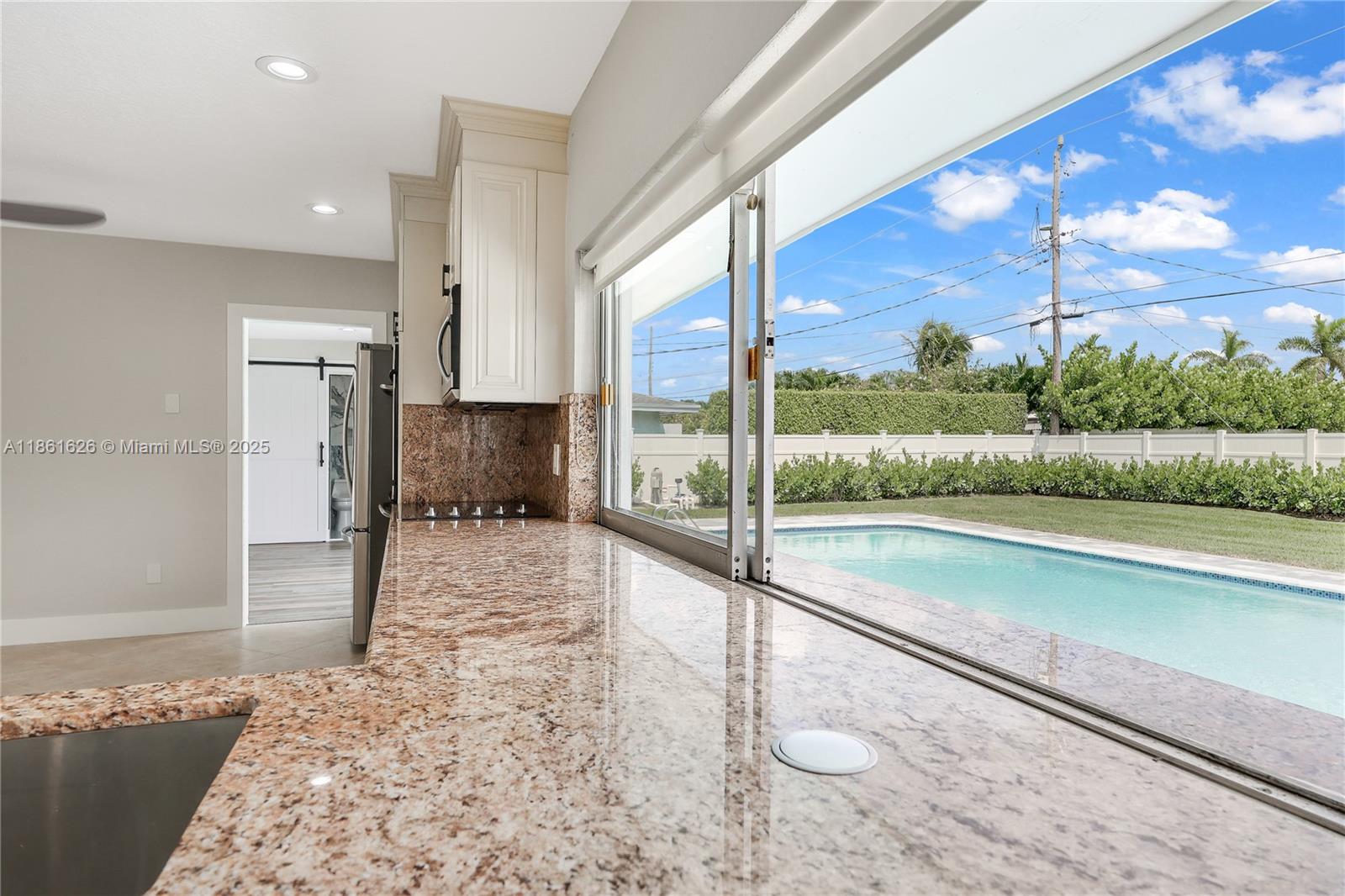 8355 Southwest 89th Street Miami, FL 33156 - Photo 25 of 29 a view of a large room with wooden floor and a balcony