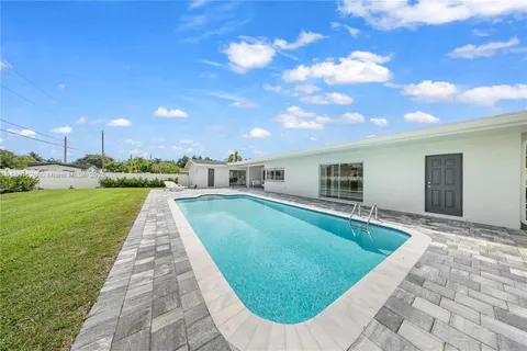 a view of grassy field with mountain