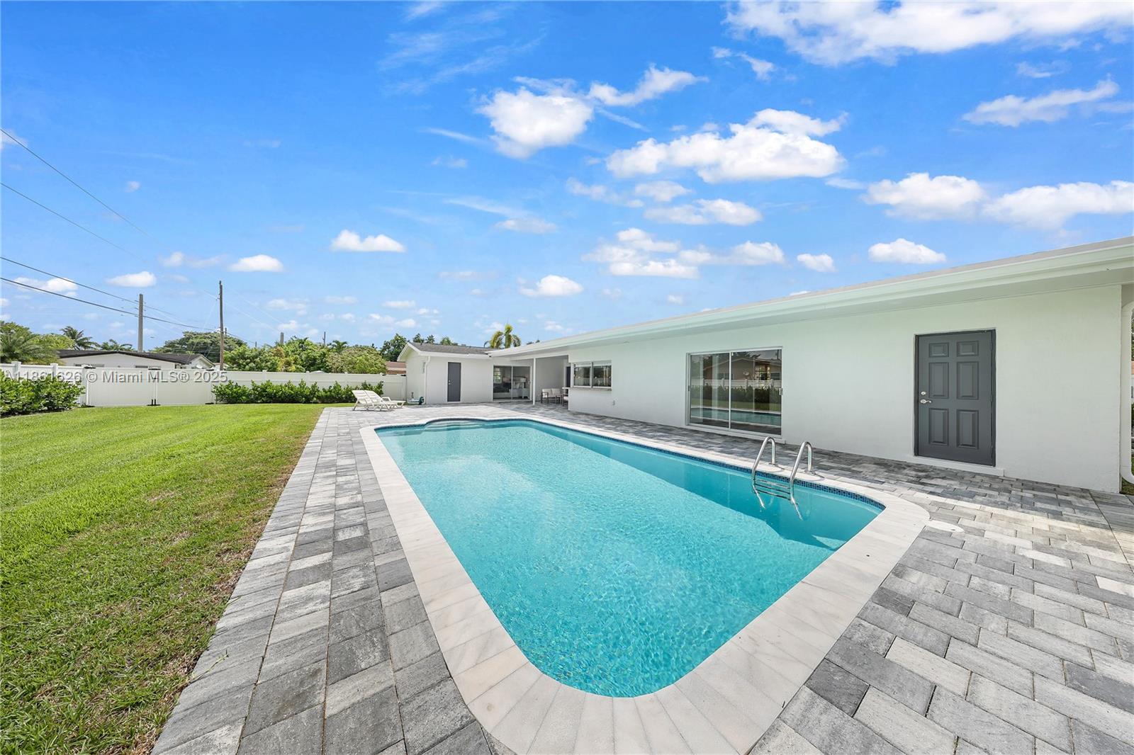 8355 Southwest 89th Street Miami, FL 33156 - Photo 26 of 29 a view of a swimming pool with a garden
