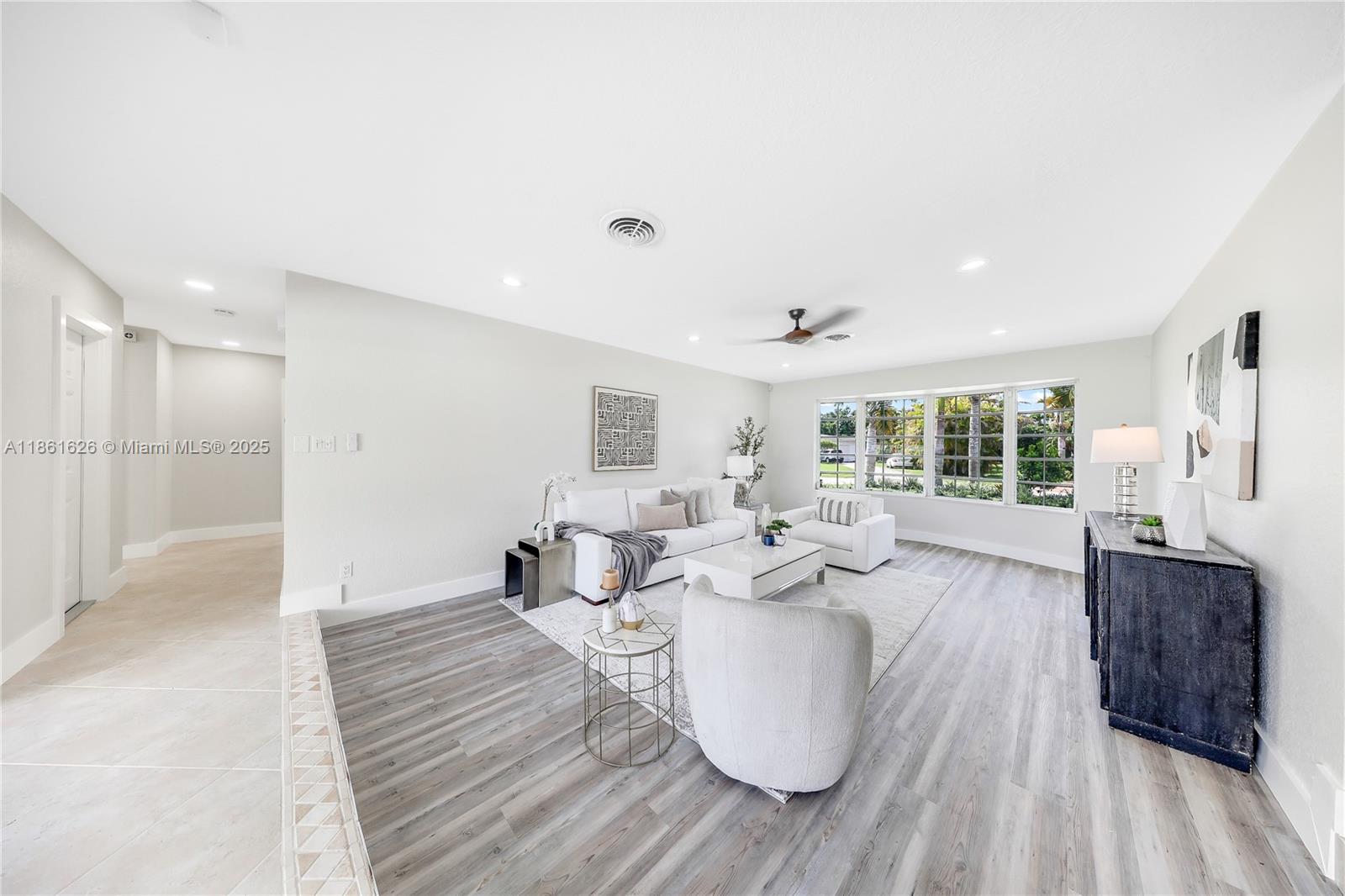 8355 Southwest 89th Street Miami, FL 33156 - Photo 3 of 29 a living room with furniture and a large window