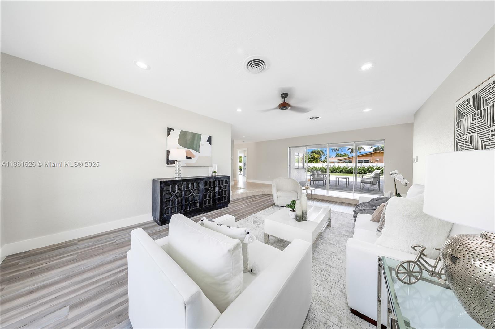 8355 Southwest 89th Street Miami, FL 33156 - Photo 5 of 29 a living room with furniture and a table