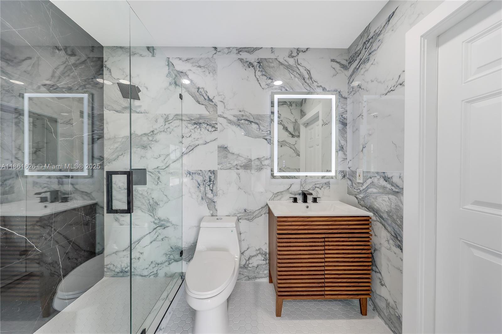 8355 Southwest 89th Street Miami, FL 33156 - Photo 9 of 29 a bathroom with a sink toilet and shower