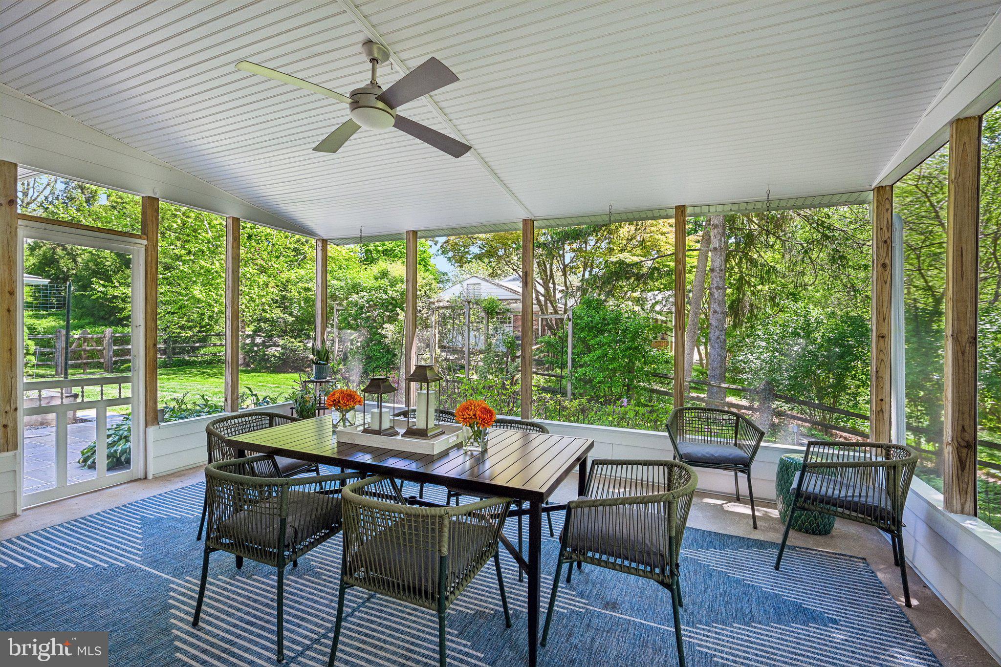 263 South Roberts Road Bryn Mawr, PA 19010 - Photo 45 of 74 Serene sunlit porch with lush views.