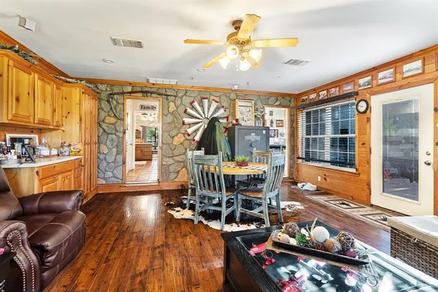 a living room filled with furniture and a large window