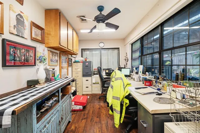 a view of a kitchen with dining table and chairs