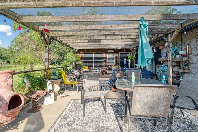 a view of a chairs and tables in patio