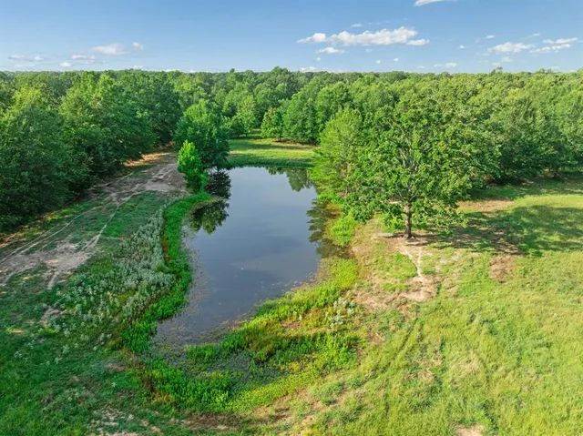 a view of a lake with a yard