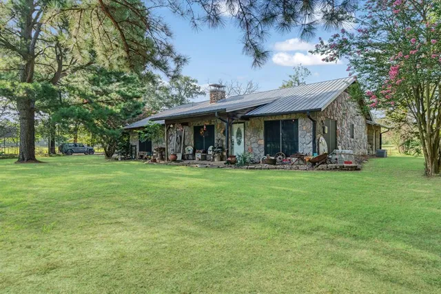 a view of a table and chairs in the garden