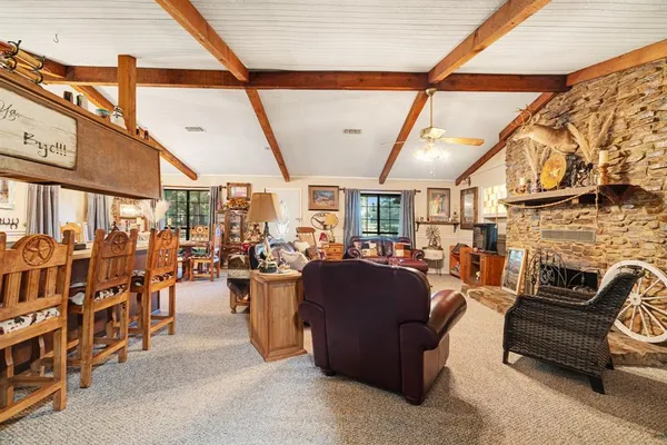 a living room with lots of furniture and fireplace