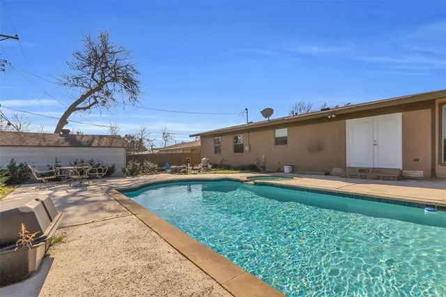 a utility room with wooden floor washer and dryer