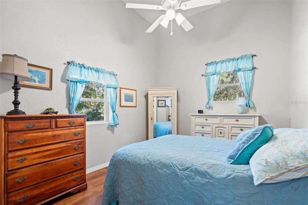 4292 Culbreath Road Brooksville, FL 34601 - Photo 16 of 41 a bedroom with a bed and a chandelier