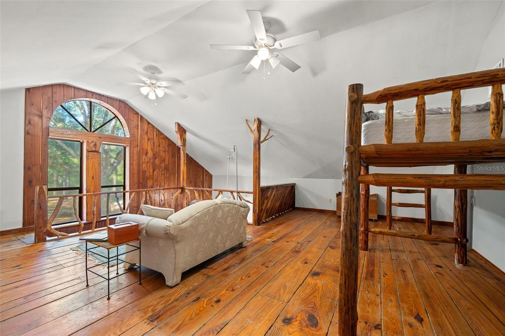 4292 Culbreath Road Brooksville, FL 34601 - Photo 19 of 41 a living room with furniture and a wooden floor