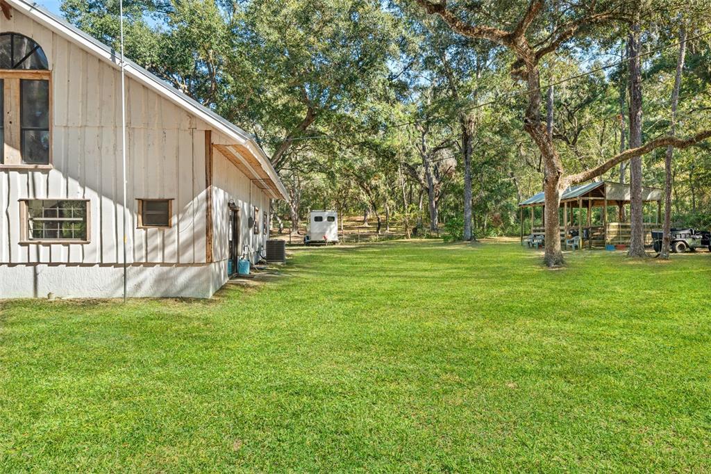4292 Culbreath Road Brooksville, FL 34601 - Photo 24 of 41 a view of a house with backyard and trees