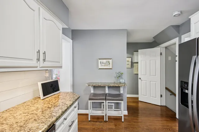 a kitchen with a refrigerator and countertop