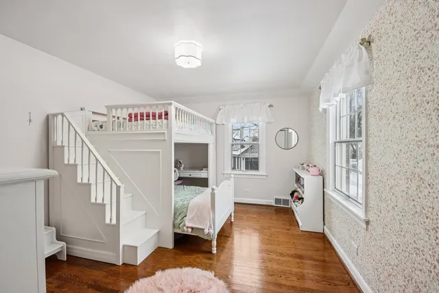 a view of an entryway with workspace and windows