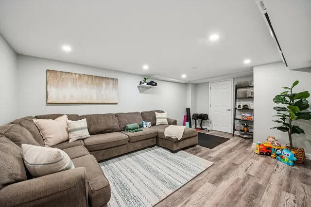 a living room with furniture and flowers
