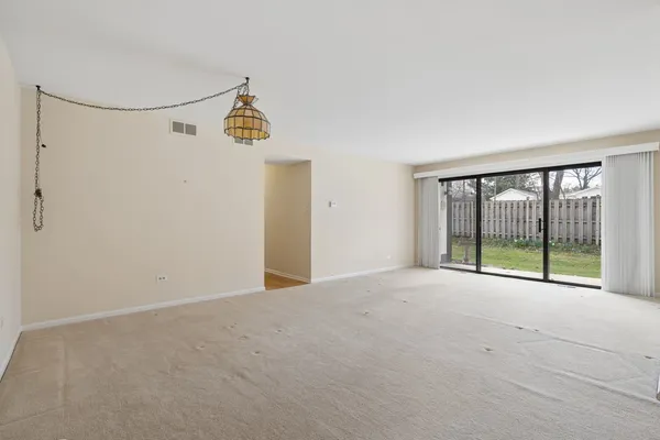 a view of a big room with closet and ceiling fan