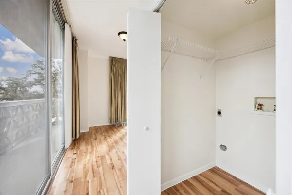 a view of bedroom with wooden floor