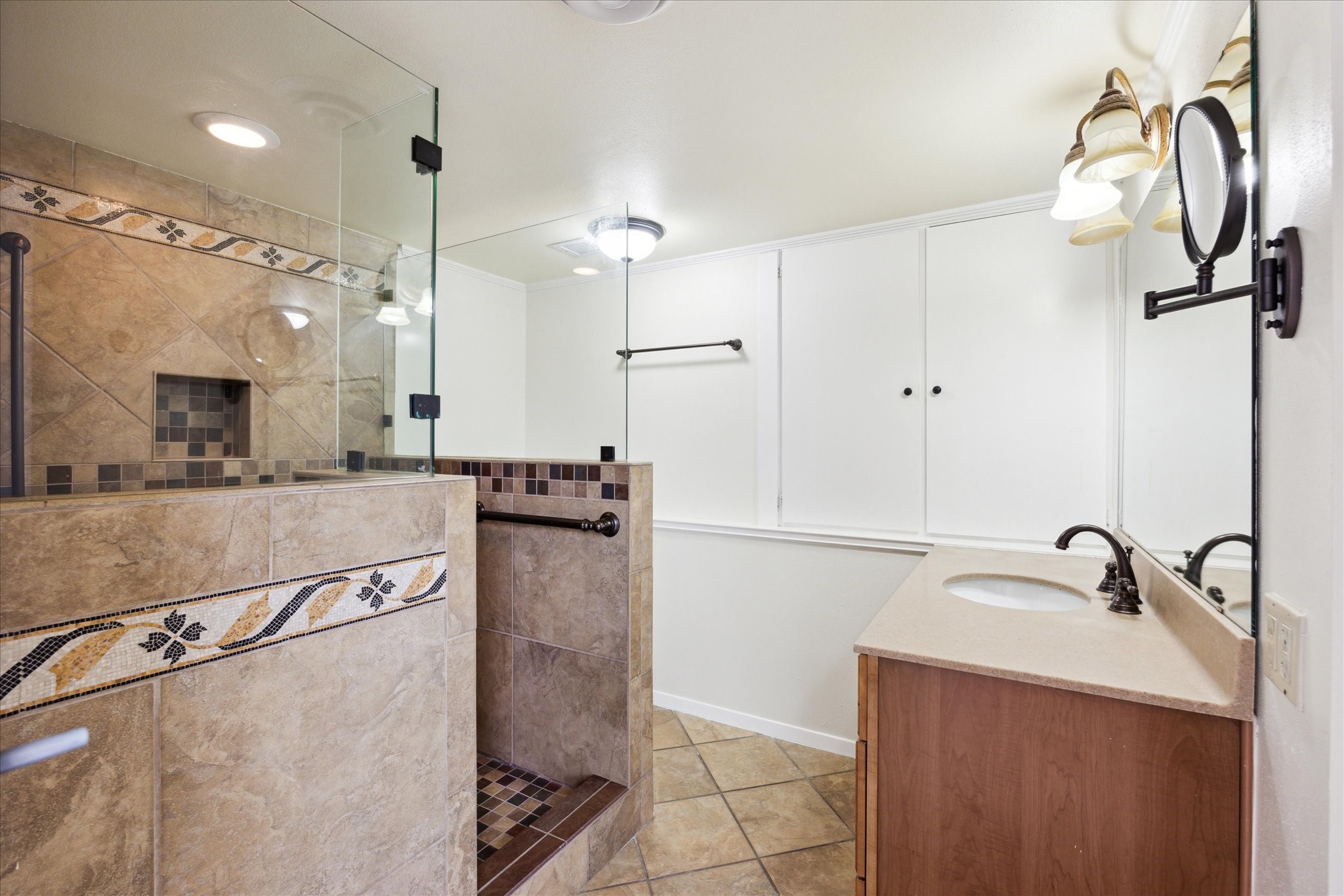 1801 Lavaca Street, Unit 2D Austin, TX 78701 - Photo 7 of 25 a bathroom with a sink and mirror