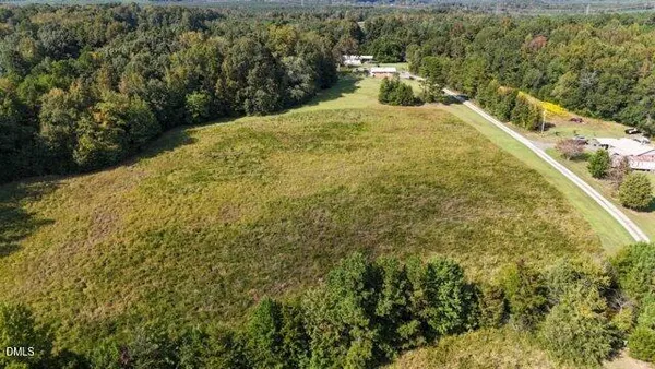 a view of a lake in middle of forest