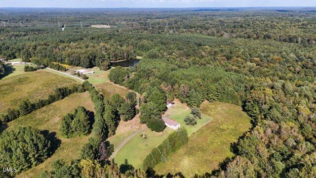 0 Owens Daye Road Rougemont, NC 27572 - Photo 14 of 16 a view of a lake in middle of forest