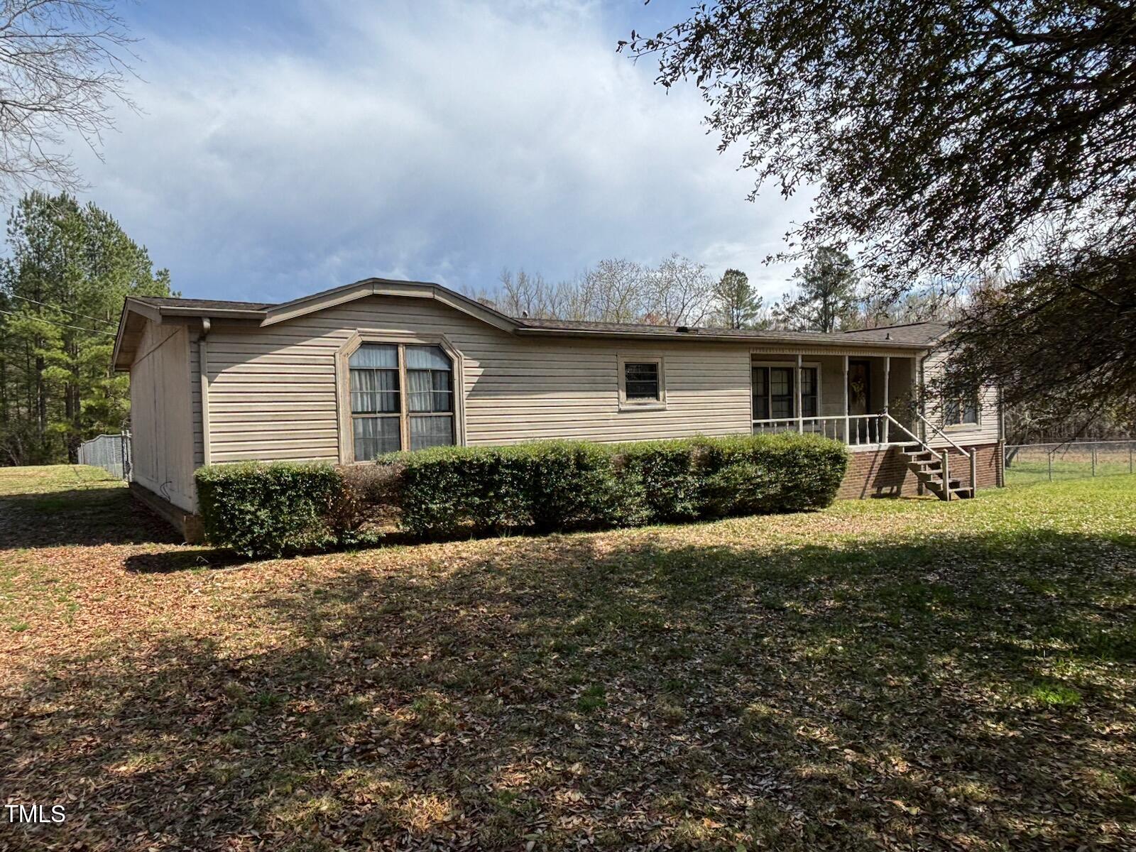 0 Owens Daye Road Rougemont, NC 27572 - Photo 3 of 16 a front view of a house with a yard