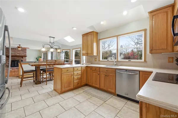 a kitchen with cabinets and chairs