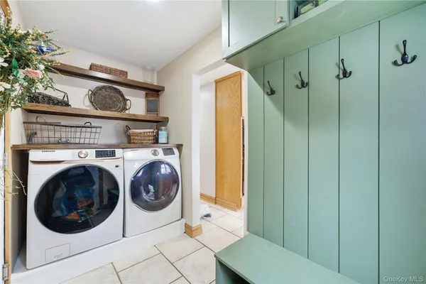 a view of a hallway with washer and dryer
