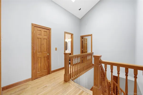 a view of hallway with wooden floor