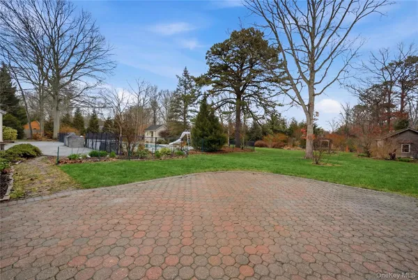 a view of pathway with a yard