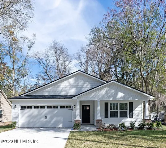 a bedroom with a bed and lamp