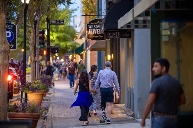 a view of street with lots of traffic signal lights