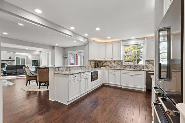 a view of a dining room with furniture and wooden floor