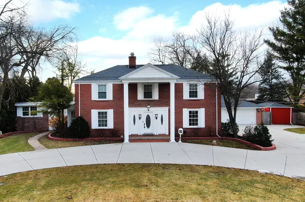 a front view of a house with swimming pool