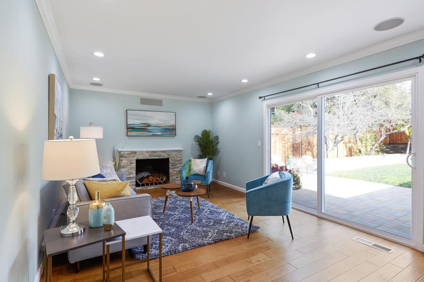 492 Dolores Drive Milpitas, CA 95035 - Photo 23 of 50 a living room with furniture a fireplace and a large window