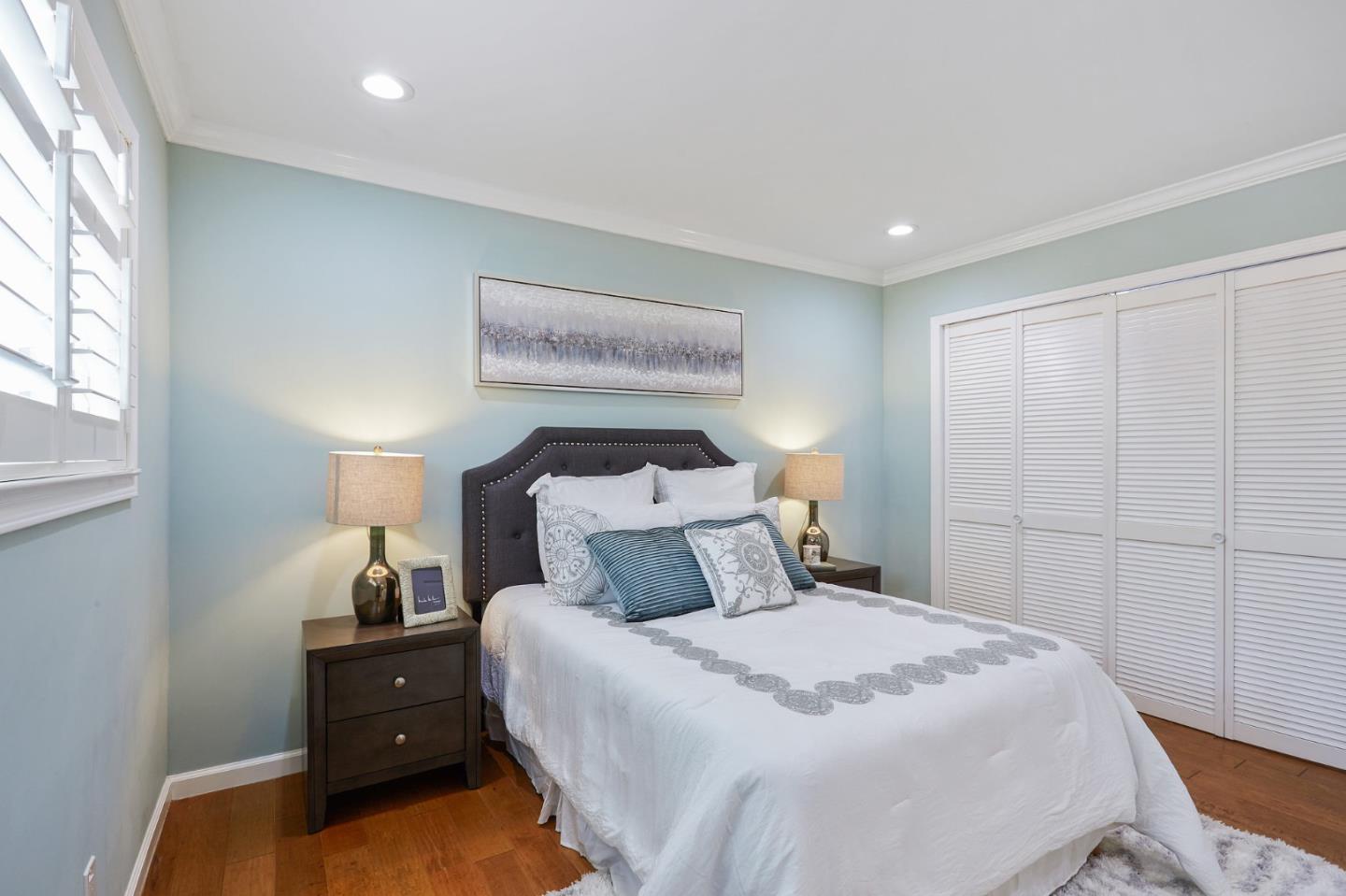 492 Dolores Drive Milpitas, CA 95035 - Photo 29 of 50 a bedroom with a bed and a lamp