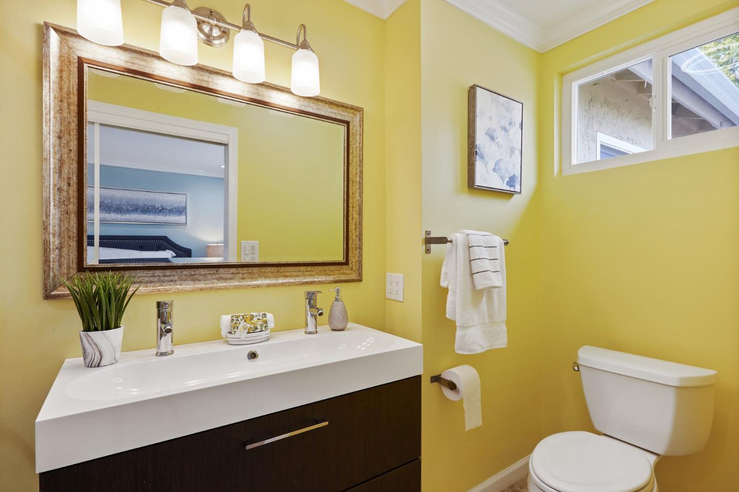 492 Dolores Drive Milpitas, CA 95035 - Photo 32 of 50 a bathroom with a toilet sink and mirror